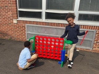 Kids playing connect 4